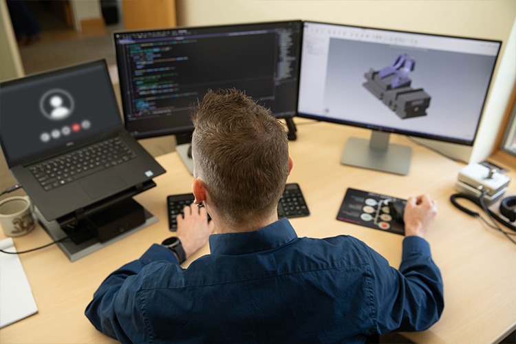 Man working with Mastercam on his computer